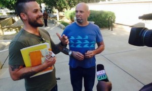 Joey Hewell, left, and Scott Lindsley, right, speak to local media after being allowed to begin, though not complete, their marriage license application.