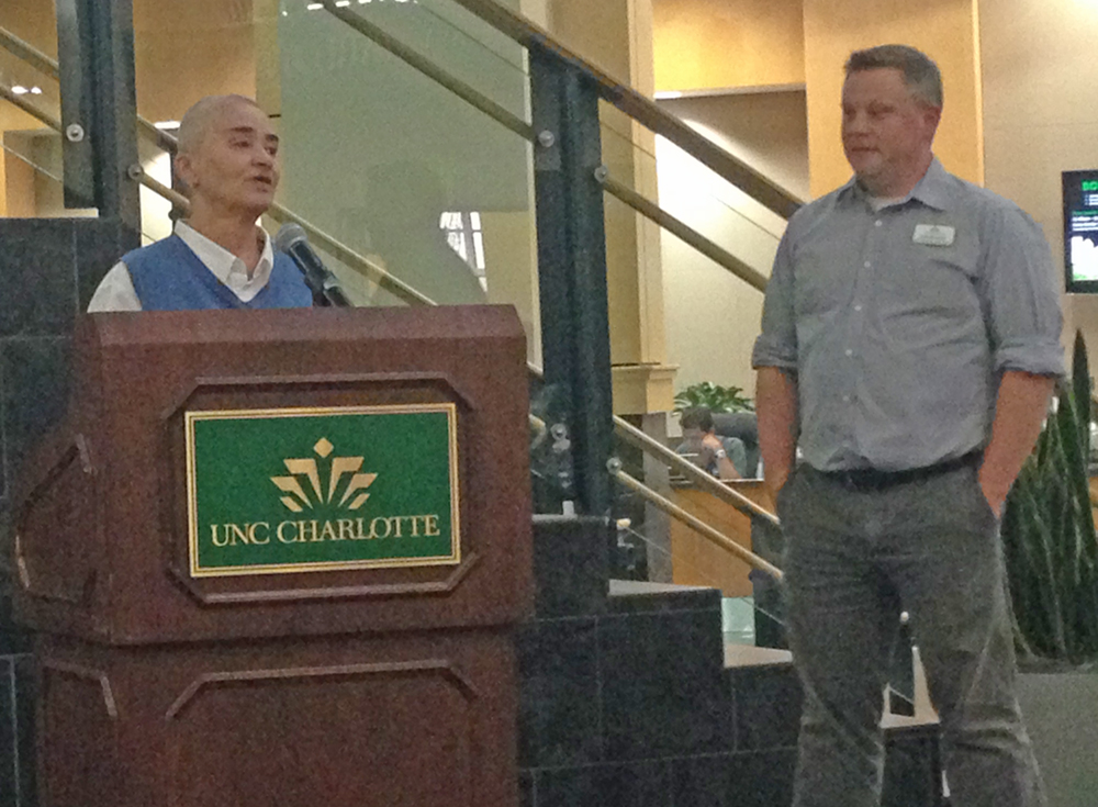 Sue Henry speaking at the archive dedication on Thursday. At right is community archivist Joshua Burford. Photo by Matt Comer.